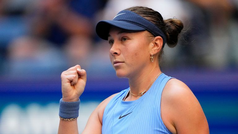 Amanda Anisimova, of the United States, reacts after scoring a point against Iga Swiatek, of Poland, during the quarterfinal round of the U.S. Open tennis championships, Wednesday, Sept. 3, 2025, in New York. (AP Photo/Yuki Iwamura)