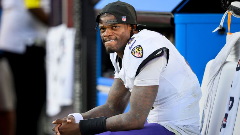 Baltimore Ravens quarterback Lamar Jackson watches from the bench during the second half of an NFL football game against the Kansas City Chiefs, Sunday, Sept. 28, 2025 in Kansas City, Mo. (AP Photo/Reed Hoffmann)