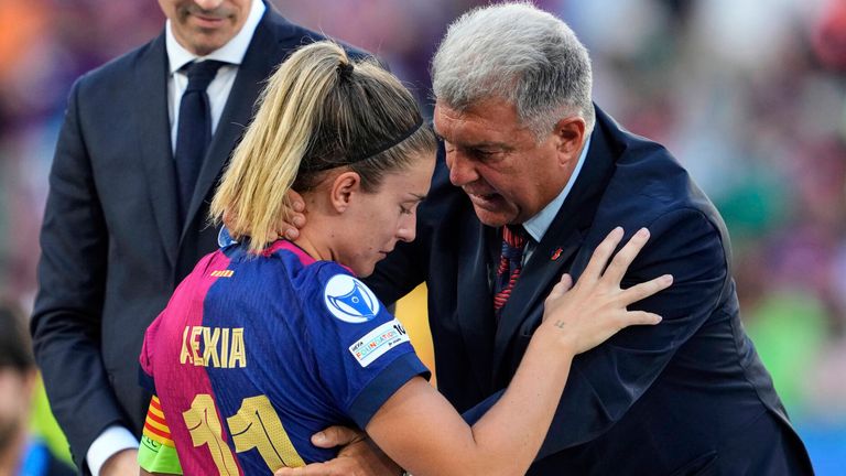 Barcelona's Alexia Putellas is comforted by Barcelona president Joan Laporta after the Champions League final