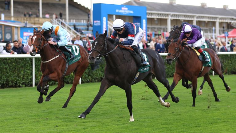 Calendar Girl ridden by Saffie Osborne (centre) on their way to winning the Weatherbys Scientific 300,000 2 Y O Stakes