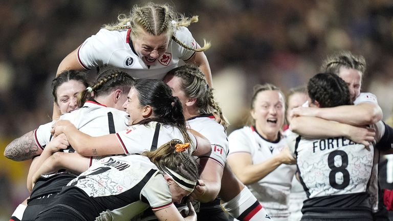 Canada's Courtney O'Donnell and team-mates celebrate after winning the Women's Rugby World Cup semi-final against New Zealand