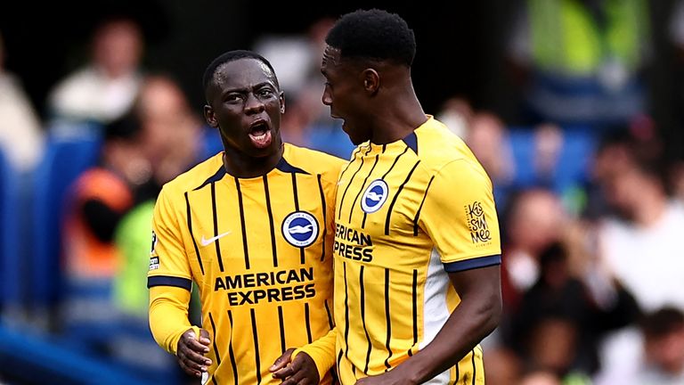 Danny Welbeck (right) celebrates his goal alongside Yankuba Minteh 