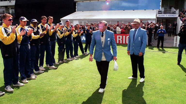 Dickie Bird walks out to a guard of honour for his last official match in 1998 between Yorkshire and Warwickshire