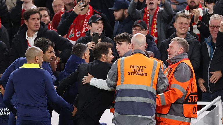 Diego Simeone had to be held back by stewards at Anfield