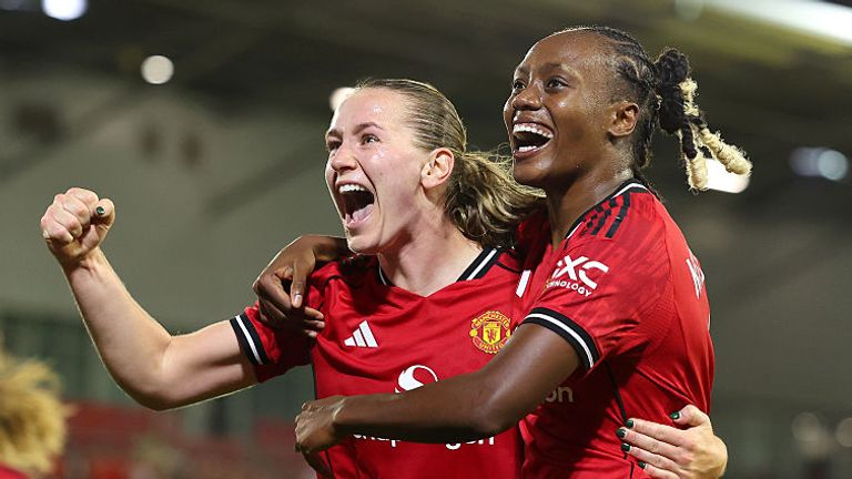 Elisabeth Terland of Manchester United celebrates scoring her team's third goal with team-mate Melvine Malard during the UEFA WCL