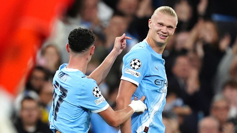 Erling Haaland celebrates with Phil Foden after putting Man City ahead against Napoli