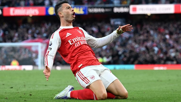 Gabriel Martinelli celebrates after scoring a late equaliser for Arsenal against Man City