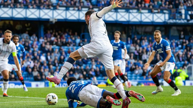GLASGOW, SCOTLAND - AUGUST 09: Rangers' Djeidi Gassama is fouled in the box by Dundee's Drey Wright before being awarded a penalty during a William Hill Premiership match between Rangers and Dundee at Ibrox Stadium, on August 09, 2025, in Glasgow, Scotland. (Photo by Alan Harvey / SNS Group)