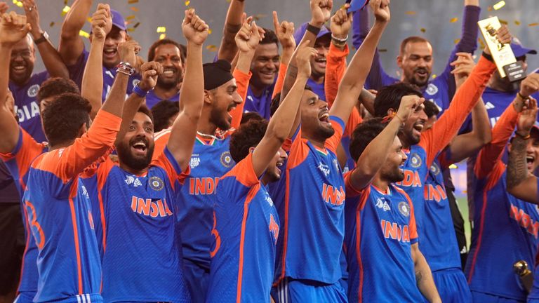 India players mimic holding up a trophy as they celebrate their 2025 Asia Cup win over Pakistan (Associated Press)