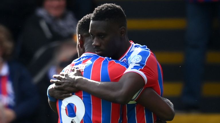 Ismaila Sarr embraces Marc Guehi after scoring the opening goal of the game