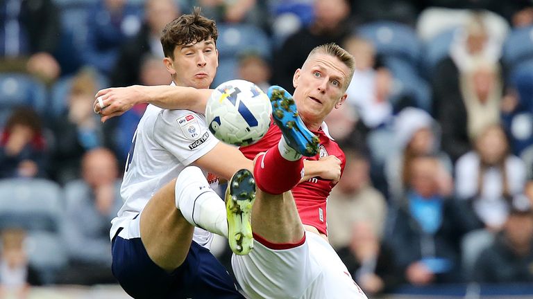 Preston North End's Jordan Storey battles for possession with Bristol City's Emil Riis Jakobsen