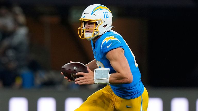Los Angeles Chargers quarterback Justin Herbert runs against the Kansas City Chiefs during the first half of an NFL football game, Friday, Sept. 5, 2025, in Sao Paulo. (AP Photo/Fernando Llano)