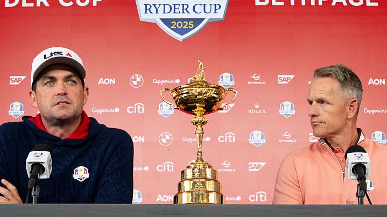 US captain Keegan Bradley and Europe captain Luke Donald sit either side of the Ryder Cup trophy during a joint press conference