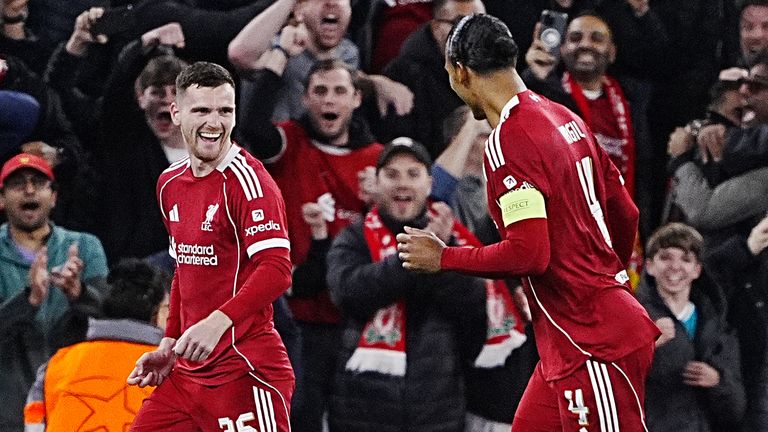 Liverpool's Andy Robertson celebrates with Virgil van Dijk after scoring against Atletico Madrid