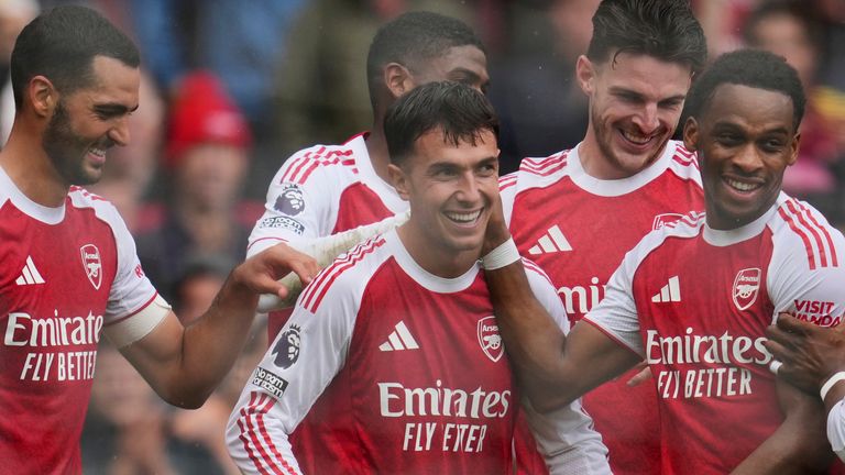 Arsenal players celebrate after Martin Zubimendi makes it 3-0 (AP Photo/Kin Cheung)