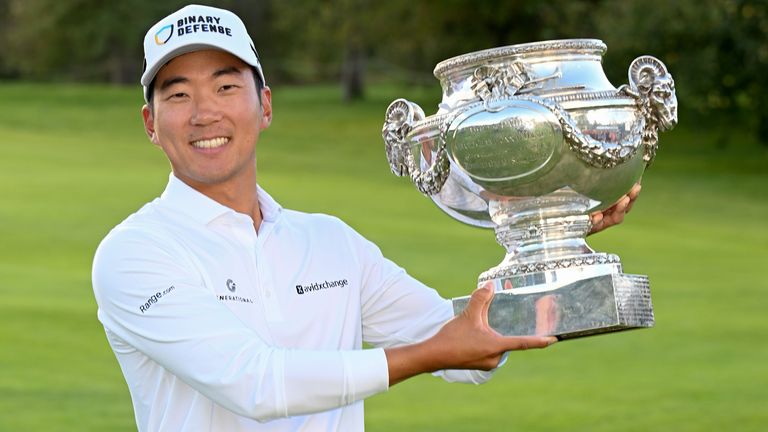 Michael Kim of the United States poses with the trophy following victory on day four of the FedEx Open de France 