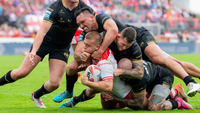 Picture by Allan McKenzie/SWpix.com - 07/09/2025 - Rugby League - Betfred Super League Round 25 - Hull KR v Hull FC - Sewell Group Craven Park, Hull, England - Hull KR's Mikey Lewis is tackled by Hull FC's Jordan Rapana, Cade Cust and Zak Hardaker.