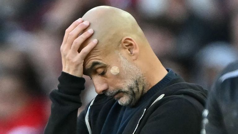 Manchester City's Spanish manager Pep Guardiola gestures on the touchline during the English Premier League football match between Arsenal and Manchester City at the Emirates Stadium in London on September 21, 2025. (Photo by Glyn KIRK / AFP) / RESTRICTED TO EDITORIAL USE. No use with unauthorized audio, video, data, fixture lists, club/league logos or 'live' services. Online in-match use limited to 120 images. An additional 40 images may be used in extra time. No video emulation. Social media in-match use limited to 120 images. An additional 40 images may be used in extra time. No use in betting publications, games or single club/league/player publications. / 