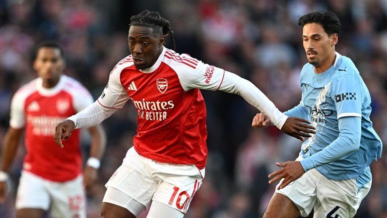 Eberechi Eze runs with the ball as Tijjani Reijnders gives chase