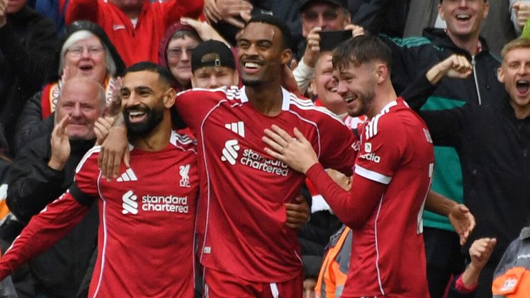Ryan Gravenberch celebrates with his team-mates after giving Liverpool an early lead against Everton