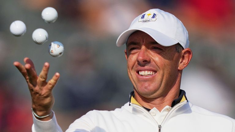 Europe's Rory McIlroy, of Northern Ireland, tosses balls in the air during a practice round for the Ryder Cup 