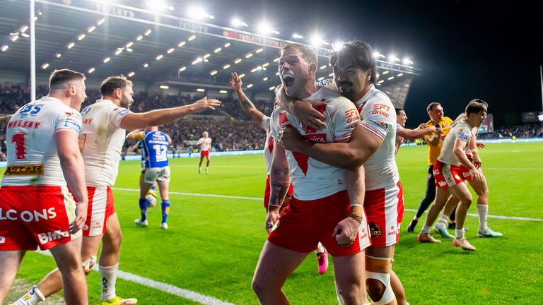 Picture by Allan McKenzie/SWpix.com - 27/09/2025 - Rugby League - Betfred Super League Eliminator - Leeds Rhinos v St Helens - AMT Headingley, Leeds, England - St Helens' Morgan Knowles and James Bell celebrate victory over Leeds.