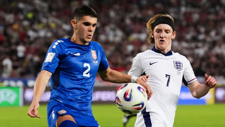 Serbia's Kosta Nedeljkovic and England's Anthony Gordon battle for the ball during the 2026 FIFA World Cup Qualifying match in Belgrade