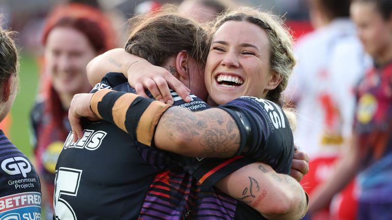 Wigan Warriors' Emily Veivers and Carys Jones celebrate the win