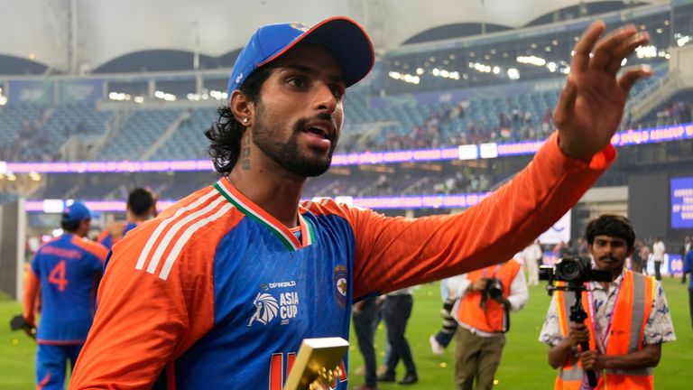 India's Tilak Varma greets fans after victory in the 2025 Asia Cup final against Pakistan (Associated Press)