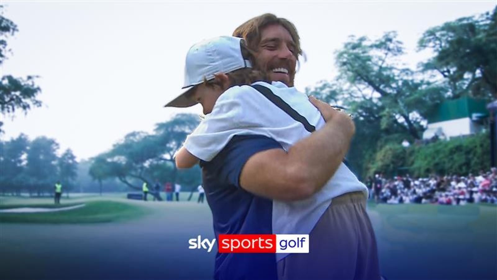 Tommy Fleetwood celebrates with son Frankie after victory at DP World India Championship