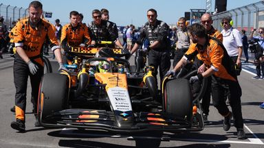 McLaren use tape on the grid wall to help guide Norris to his grid slot 