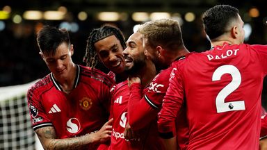 Manchester United's Matheus Cunha (centre) celebrates with team-mates after scorin