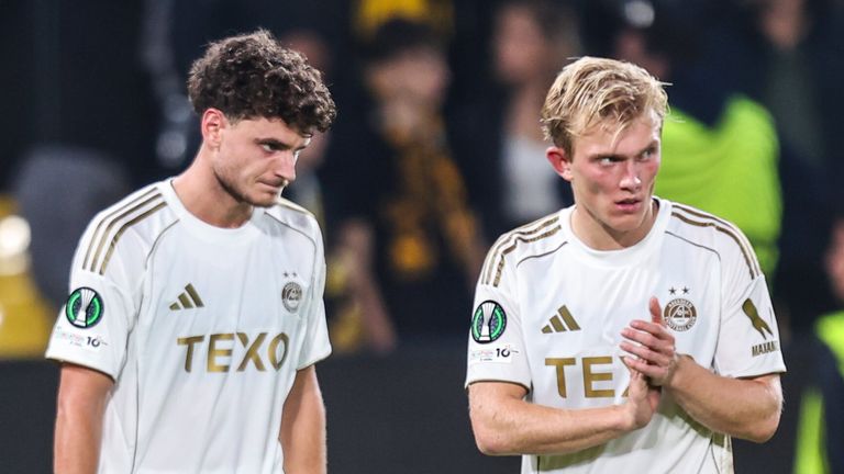 Aberdeen's Dante Polvara (L) and Alexander Jensen look dejected at full time against AEK Athens