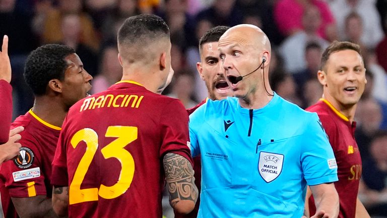 Referee Anthony Taylor and Roma players during the 2023 Europa League final