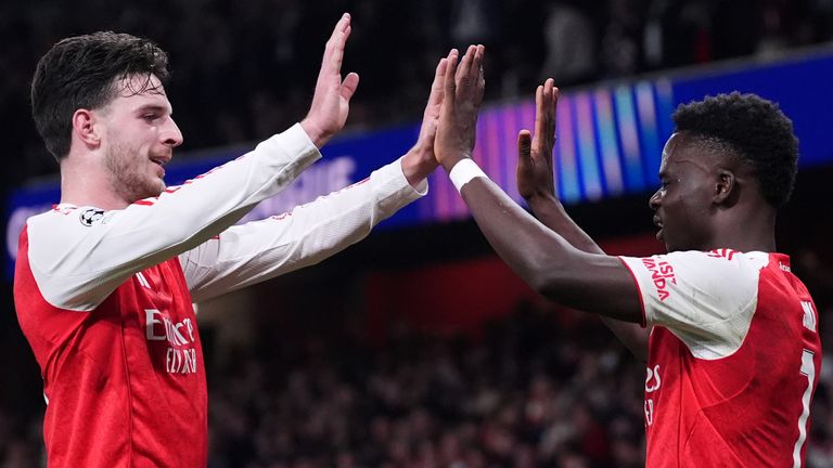 Arsenal's Bukayo Saka celebrates with Declan Rice after scoring the second goal against Olympiakos