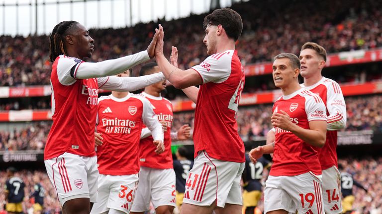 Arsenal's Declan Rice (centre) celebrates with Eberechi Eze (left) after scoring against West Ham