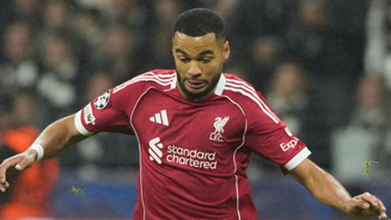 Liverpool's Cody Gakpo, left, and Frankfurt's Rasmus Kristensen challenge for the ball during the Champions League opening phase soccer match between Eintracht Frankfurt and Liverpool in Frankfurt, Germany, Wednesday, Oct. 22, 2025. (AP Photo/Michael Probst)