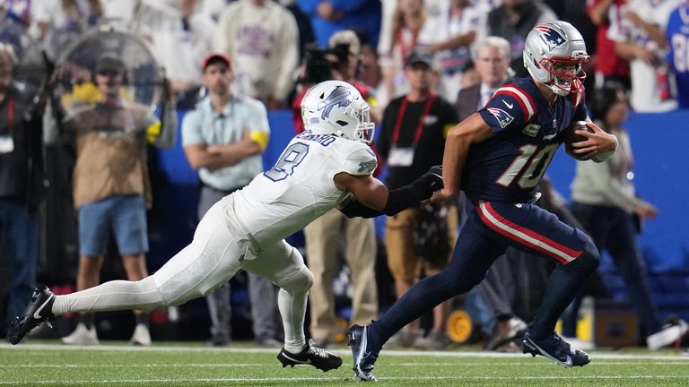 New England Patriots quarterback Drake Maye (10) is stopped by Buffalo Bills linebacker Terrel Bernard (8) on a run during the first half of an NFL football game, Sunday, Sept. 5, 2025, in Orchard Park, N.Y. (AP Photo/Gene J. Puskar)