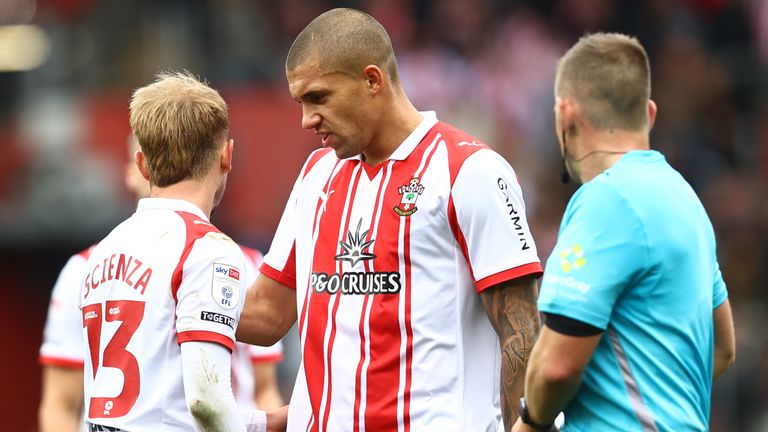 Nathan Wood speaks to team-mate Leo Scienza during Southampton's goalless draw with Swansea