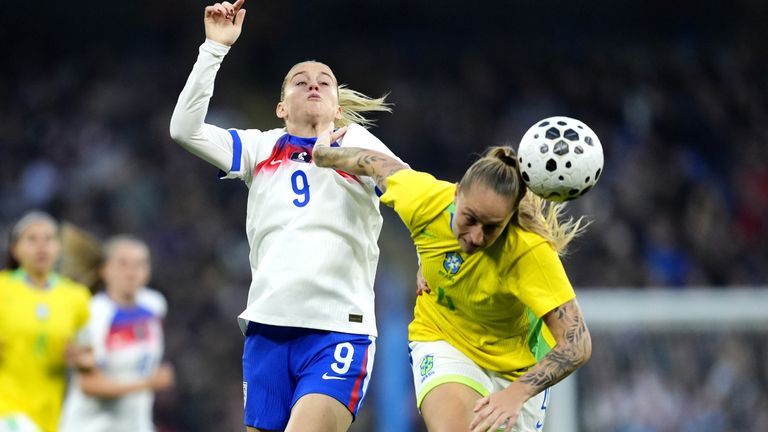 Alessia Russo challenges for the ball