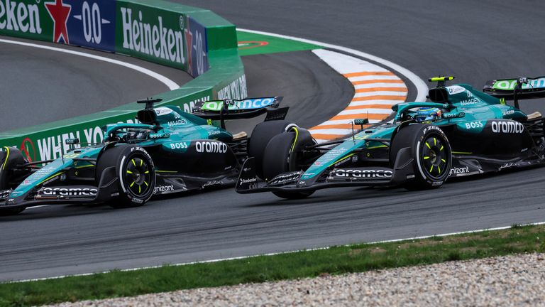 Aston Martin's Lance Stroll and Fernando Alonso go wheel to wheel