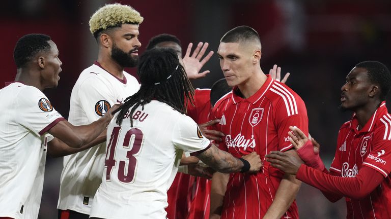Nottingham Forest's Nikola Milenkovic exchanges words with Midtjylland's Kevin Mbabu during the UEFA Europa League