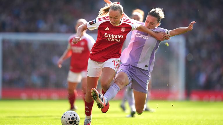 Arsenal's Frida Maanum (left) and Brighton's Maisie Symonds compete for possession