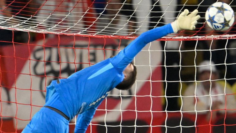 Tottenham's goalkeeper Guglielmo Vicario makes a save during a Champions League opening phase soccer match between Monaco and Tottenham Hotspur in Monaco, Wednesday, Oct. 22, 2025. (AP Photo/Philippe Magoni)