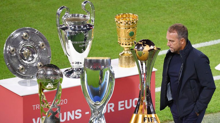 FOTOMONTAGE:.Zum Ende der Aera von Hansi Flick als Trainer von Bayern Muenchen..Archivfoto:.Das Triple-Schale,Meisterschale,Champions League Pokal und DFB Pokal werden praesentiert-Hans Dieter Flick (Hansi ,Trainer Bayern Muenchen) geht scheinbar achtlos daran vorbei..Pokal,Cup,Trophaee.Sachaufnahme..Fussball 1. Bundesliga Saison 2020/2021,1.Spieltag,Spieltag01,.FC Bayern Muenchen (M) - FCSchalke 04 (GE) 8-0,.am 18.09.2020 in Muenchen.A L L I A N Z A R E N A,.DFL REGULATIONS PROHIBIT ANY USE OF PHOTOGRAPHS AS IMAGE SEQUENCES AND/OR QUASI-VIDEO.EDITORIAL USE ONLY....SVEN SIMON Fotoagentur GmbH & Co. Pressefoto KG # Prinzess-Luise-Str. 41 # 45479 M u e l h e i m / R u h r # Tel. 0208/9413250 # Fax. 0208/9413260 # GLS Bank # BLZ 430 609 67 # Kto. 4030 025 100 # IBAN DE75 4306 0967 4030 0251 00 # BIC GENODEM1GLS # www.svensimon.net.