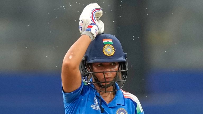 India captain Harmanpreet Kaur waves away flying insects during the World Cup match against Pakistan in Colombo (Associated Press)