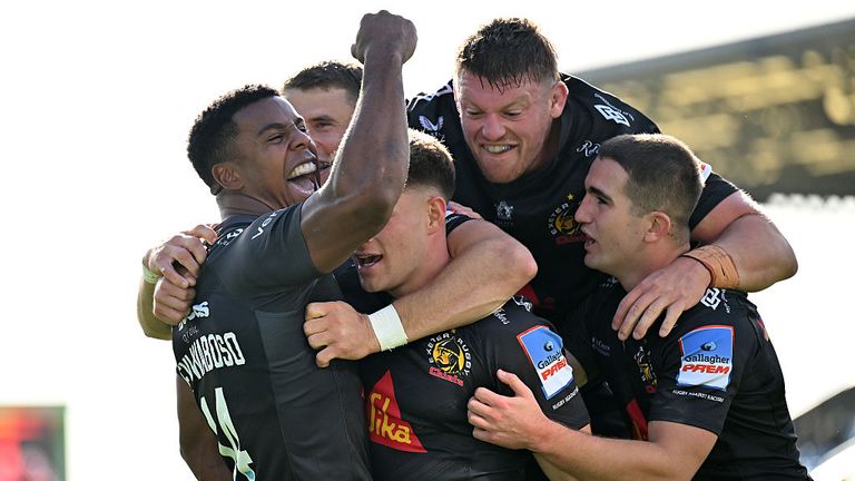 Immanuel Feyi-Waboso of Exeter Chiefs celebrates with his team mates after scoring his side's third try