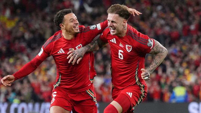 Ethan Ampadu (left) runs alongside Wales team-mate Joe Rodon after a goal against Belgium on October 13
