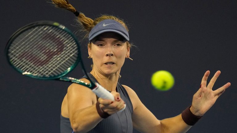 Katie Boulter of Great Britain returns a shot from Amanda Anisimova of the United States in a women's singles match for the China Open tennis tournament in Beijing, China, Friday, Sept. 26, 2025. (AP Photo/Ng Han Guan)