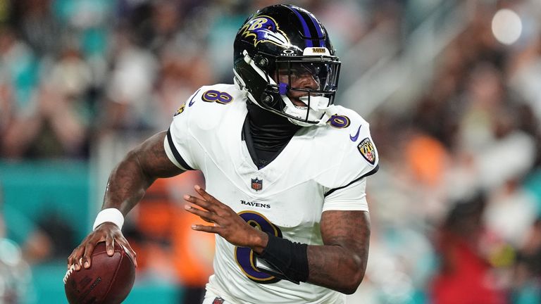 Baltimore Ravens quarterback Lamar Jackson (8) looks to throw against the Miami Dolphins during the first half of an NFL football game, Thursday, Oct. 30, 2025, in Miami Gardens, Fla. (AP Photo/Rebecca Blackwell)